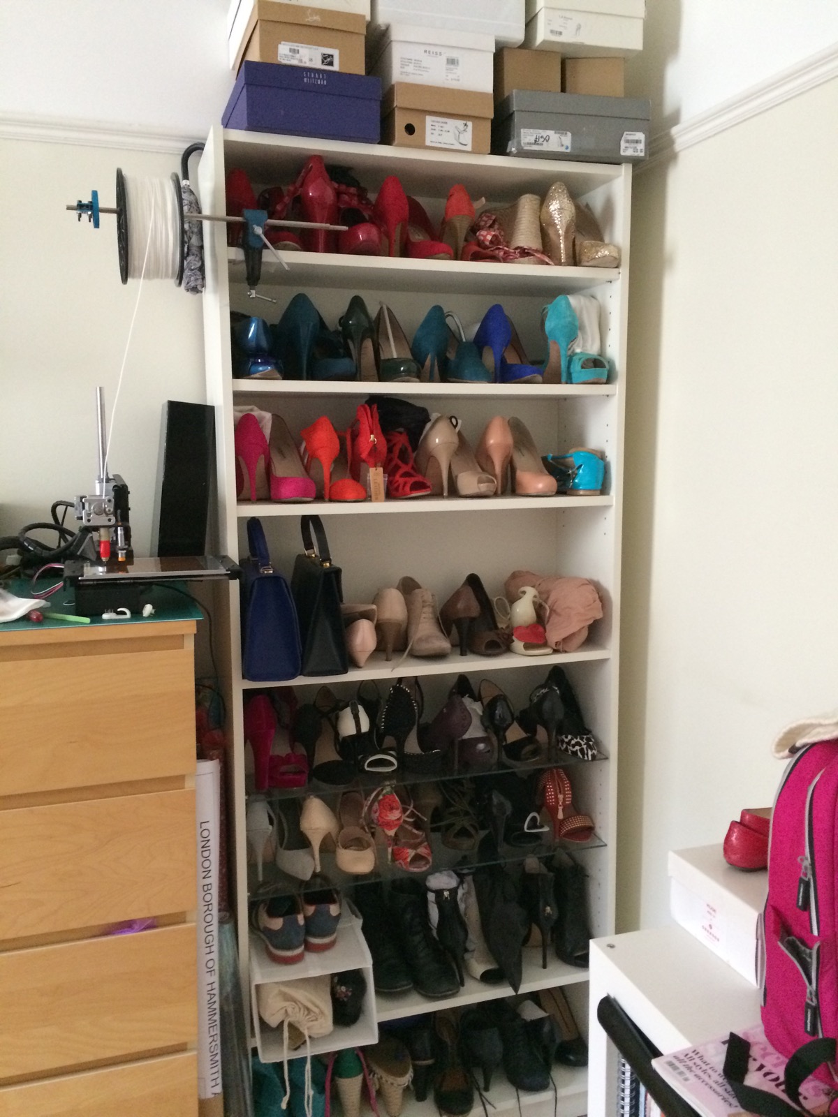 my shoecase. a bookcase full of shoes. 
