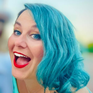 Woman with blue hair smiling